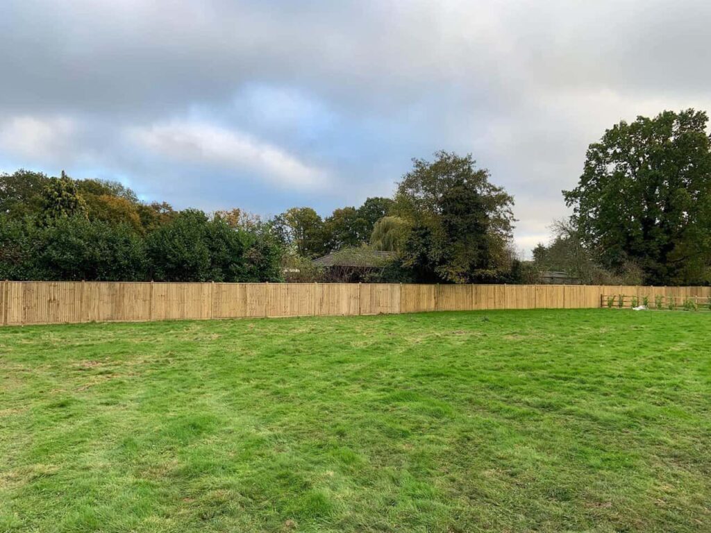 This is a photo of feather edge fencing installed around the edge of a field by Fast Fix Fencing Tunbridge Wells